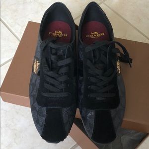 Coach women’s sneakers black with gold lettering